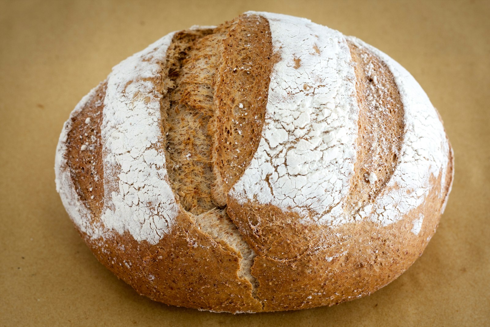 A scored, floured sourdough loaf