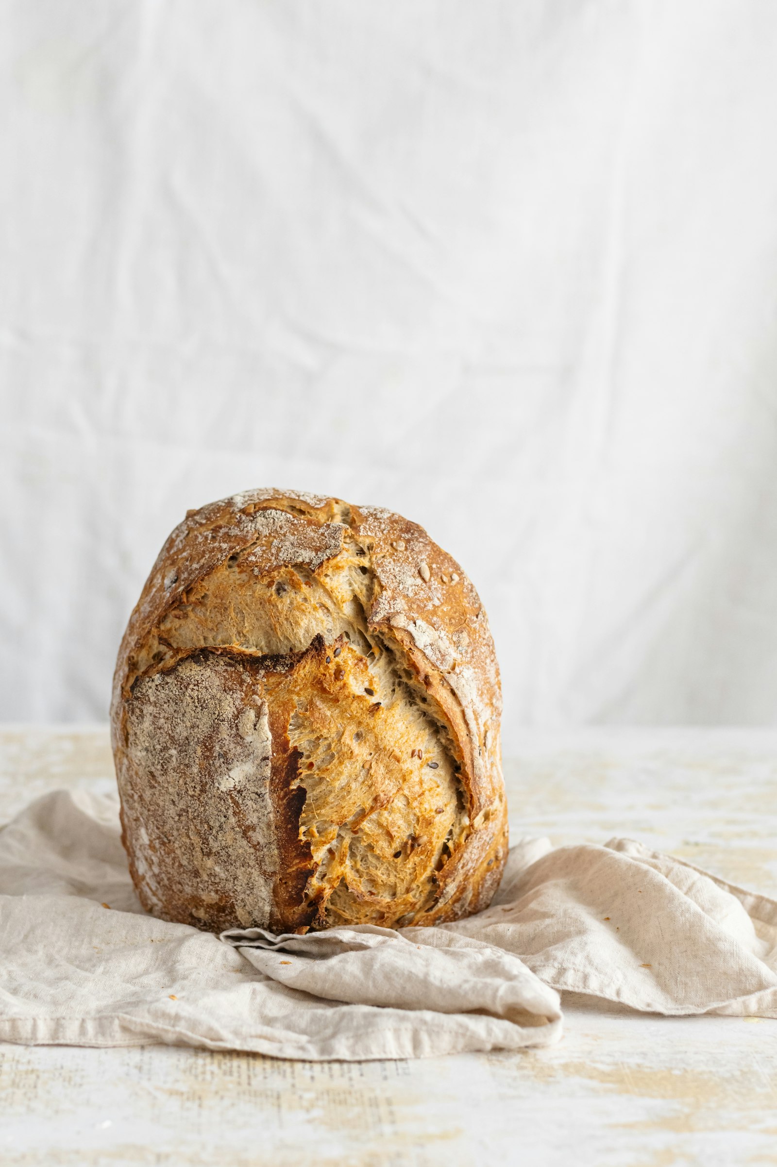 A loaf resting on a linen cloth